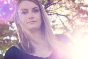 whimsical lifestyle portrait with sun flare at scottsdale civic plaza