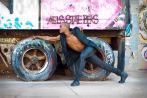hip hop portrait set in urban alley with graffiti